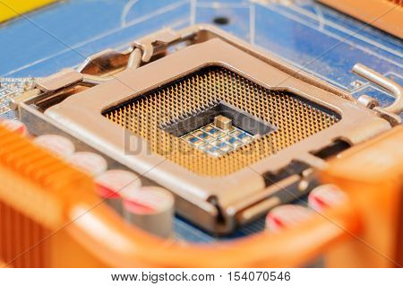 Empty CPU socket on motherboard. Selective focus.