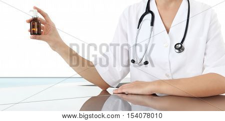 Doctor holding medical spray bottle. Health care concept