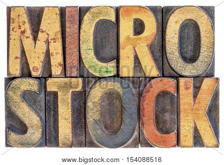 microstock photography concept - isolated word abstract in vintage letterpress wood block type, stained by color ink