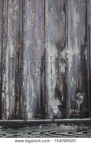 Vertical old wood background texture with peeling paint