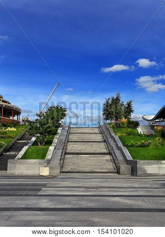 Concrete columnar stairway surrounded by flower beds