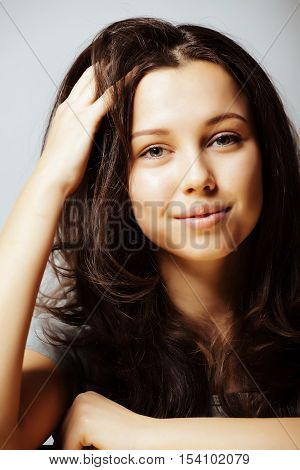 young pretty taned girl close up portrait smiling confident brunette warm, lifestyle real people concept