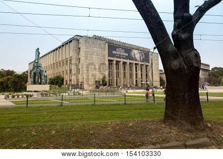 Krakow Poland - October 2 2016: Building the National Museum in Krakow with a big poster advertising the exhibition: Mary Mother of Mercy MMM
