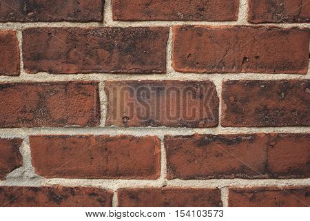 Close up red weathered brick background texture