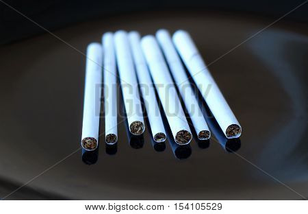Super slims, slims and king size cigarette closely isolated on black