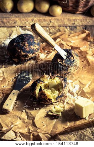 Jacket potatoes from campfire od old baking paper