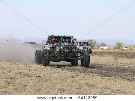 Speeding Black Porter Rally Car Front View