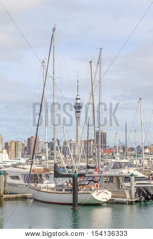Auckland New Zealand- December 10 2013. Auckland sky tower and harbor view from the Westhaven Marina.