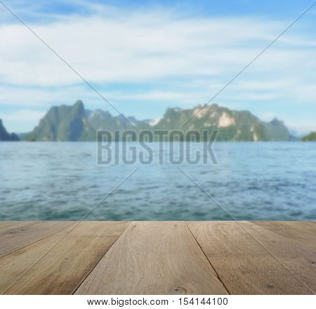 Wood Table Top On Blurred Beautiful Landscape With Mountain And Lake