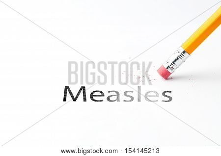 Closeup of pencil eraser and black measles text. Measles. Pencil with eraser.