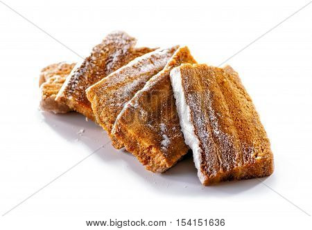 apple  paste (pastila) sliced pieces sprinkle with sugar powder close-up isolated on white background