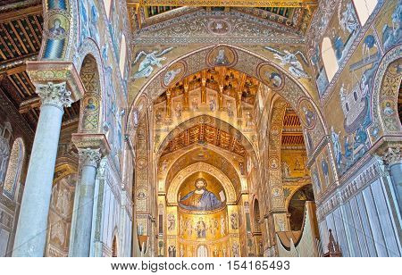 MONREALE ITALY - OCTOBER 10 2016: The prayer hall of Cathedral of Assumption of Virgin Mary decorated with mosaic icons and patterns carved wooden and stone elements on October 10 in Monreale.
