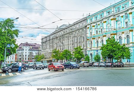 KHARKOV UKRAINE - MAY 20 2016: The traffic in the city center with the scenic old buildings on the background on May 20 in Kharkov.