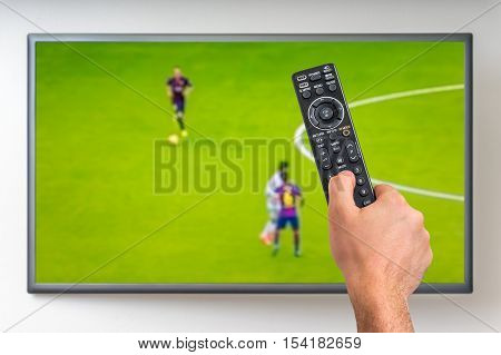 Man Is Watching Football Match On Tv