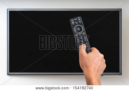 Man Is Going To Switch On Tv