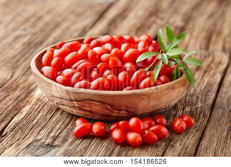 Goji berries on a wooden background