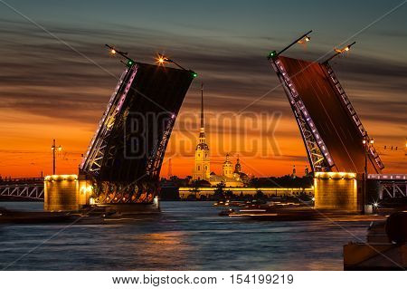 Open Palace Bridge and view of the Peter and Paul Fortress in St.Petersburg in white night
