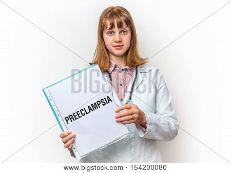 Doctor Showing Clipboard With Written Text: Preeclampsia
