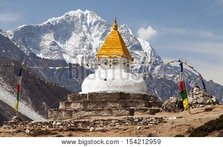 Stupa near Dingboche village with prayer flags and mounts Kangtega and Thamserku - way to mount Everest base camp - Khumbu valley - Nepal