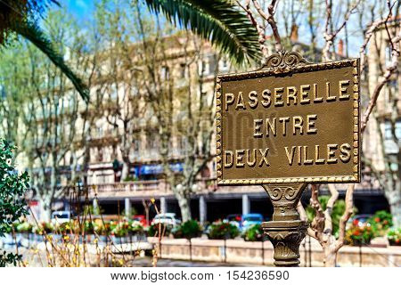 Bridge between the two cities sign. Footbridge across The Canal de la Robine in Narbonne city. Languedoc-Roussillon France