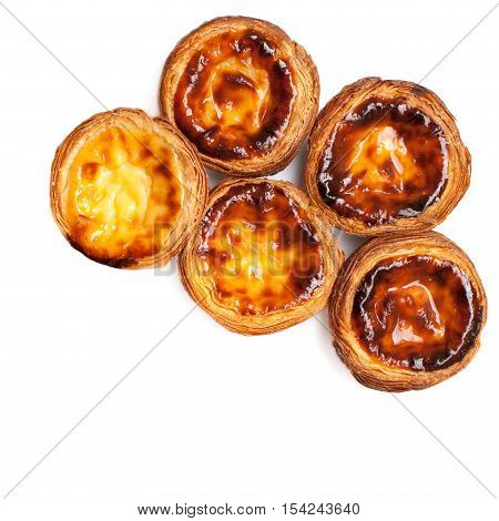 Egg Tarts isolated on white background. Heap of Typical portuguese dessert pasteis de nata close up