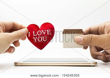 woman and man get marry : woman holding red heart "I love you" man holding home model over smartphone
