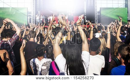 People at a concert with hands up