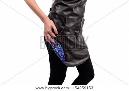 Young woman chef or waiter posing, wearing apron and white t-shirt isolated on white background