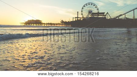 Santa monica sunset on the beach with pier on the background