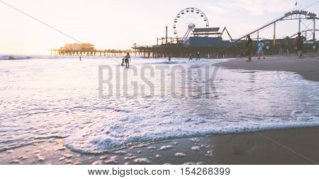 Santa monica sunset on the beach with pier on the background