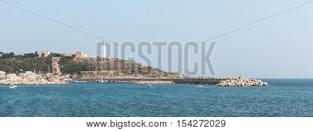 View of the promontory of Leuca the ionic lighthouse and the historical sanctuary Santa Maria di Leuca. Leuca Salento Apulia Italy