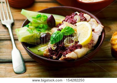 Cod with Olives and Fennel rustic style..seletive focus
