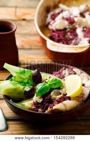 Cod with Olives and Fennel rustic style..seletive focus
