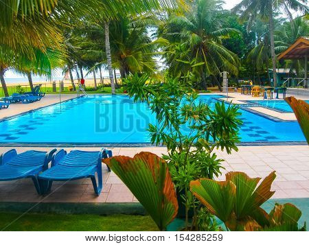 Negombo Sri Lanka - April 29 2009: The swimming pool at Camelot Beach Hotel at tropical country Sri Lanka
