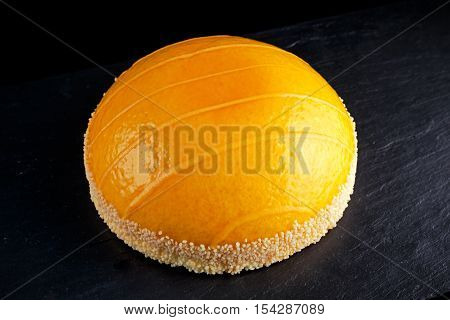 Cake witch Orange mousse and Mandarin sauce.