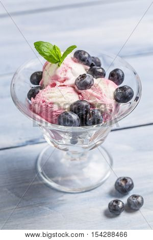 Bowl With Blueberry Ice Cream And Leaf Mint