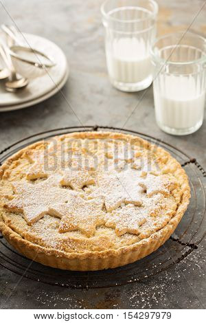 Traditional scandinavian almond tart decorated with powdered sugar