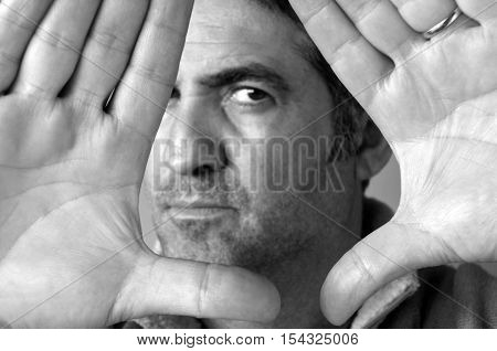 Man Blocks With His Hands His Face