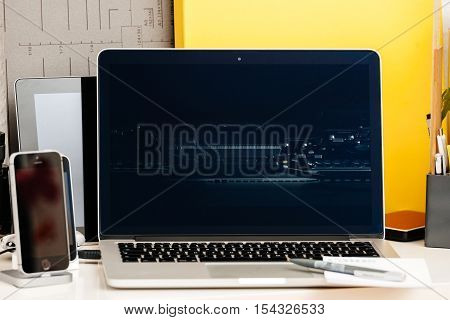 PARIS FRANCE - OCT 28 2016: Apple Computers website on new MacBook Pro Retina with OLED Touch bar in geek creative room showcasing Apple Keynote presentation of interior of Apple Computer