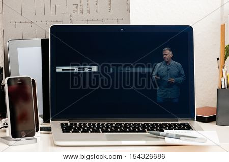 PARIS FRANCE - OCT 28 2016: Apple Computers website on new MacBook Pro Retina with OLED Touch bar in geek creative room showcasing Apple Keynote presentation of Thunderbolt 3 with USB 3
