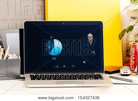 PARIS FRANCE - OCT 28 2016: Apple Computers website on new MacBook Pro Retina with OLED Touch bar in geek creative room showcasing Apple Keynote presentation of iOS vs Android adoption users