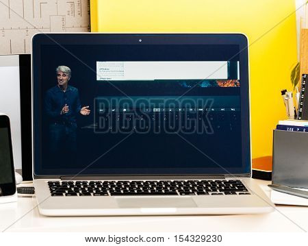 PARIS FRANCE - OCT 28 2016: Apple Computers website on new MacBook Pro Retina with OLED Touch bar in geek creative room showcasing Apple Keynote presentation Craig Federighi talking about new MacBook Pro