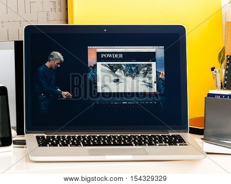 PARIS FRANCE - OCT 28 2016: Apple Computers website on new MacBook Pro Retina with OLED Touch bar in geek creative room showcasing Apple Keynote presentation Craig Federighi talking about new MacBook Pro