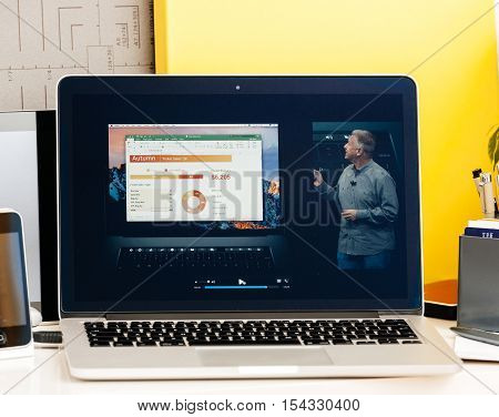 PARIS FRANCE - OCT 28 2016: Apple Computers website on new MacBook Pro Retina with OLED Touch bar in geek creative room showcasing Apple Keynote presentation of Philip Schiller inegration software