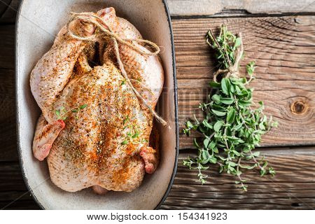 Raw Chicken With Herbs In Casserole Dish