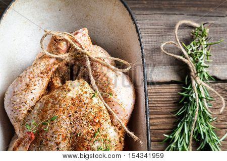 Closeup Of Raw Chicken With Herbs In Casserole Dish