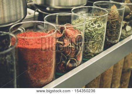 Dried of bale fruit herb in bottle at morning market. street food in thailand