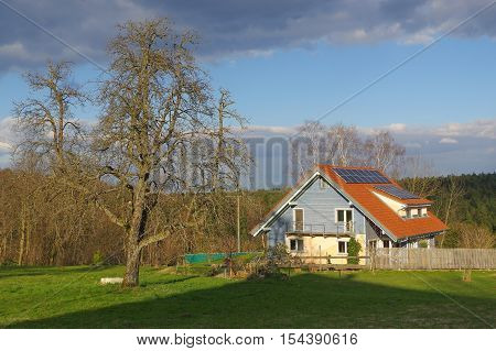 a german rural landscape with wooden house near spring forest. Black Forest in Baden Wuertemberg Schoemberg in Germany