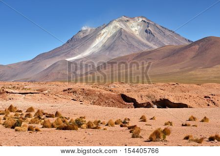 Ollague or Ullawi is a massive andesite stratovolcano in the Andes on the border between Bolivia and northern Chile.