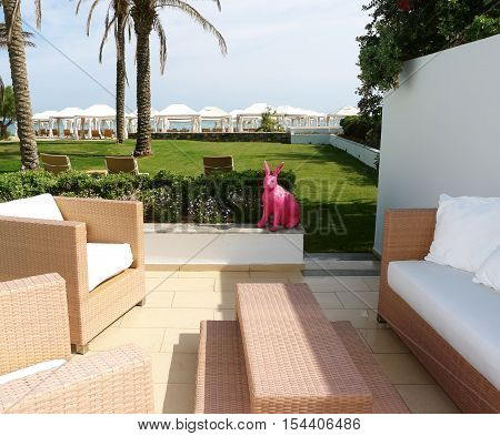 HERAKLION CRETE GREECE - MAY 13 2014: The deep decorative rabbit on the terrain of villa in luxury class hotel on the Mediterranean coast of Crete May 13 2014 Greece.